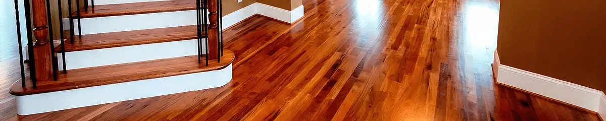 Base floor of a staircase with professionally restored wood flooring in Stamford CT