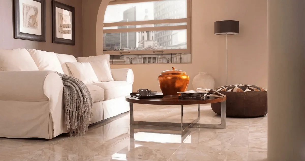Modern living room with professionally installed marble flooring, a beige sofa, coffee table in Stamford, CT