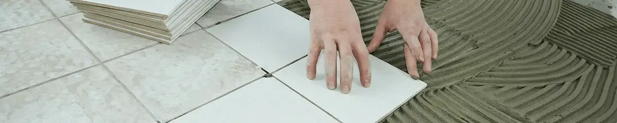 Professional installing white tile floors in Stamford, CT