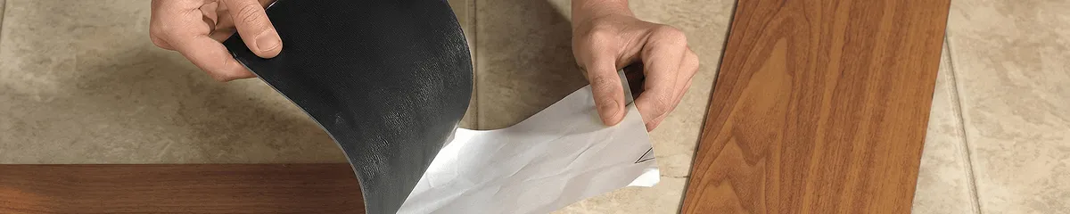 A professional installing vinyl flooring in Stamford, CT